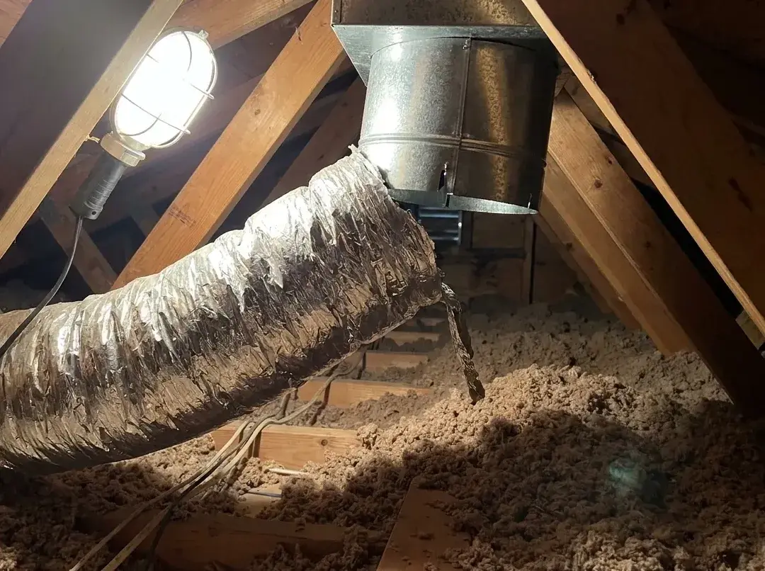 Duct that has come apart in an attic, blowing into the insulation